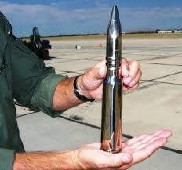 A 30mm round held by a pilot. 