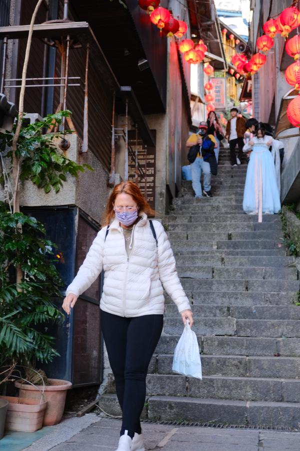 Mom coming down the stairs in Jiufen