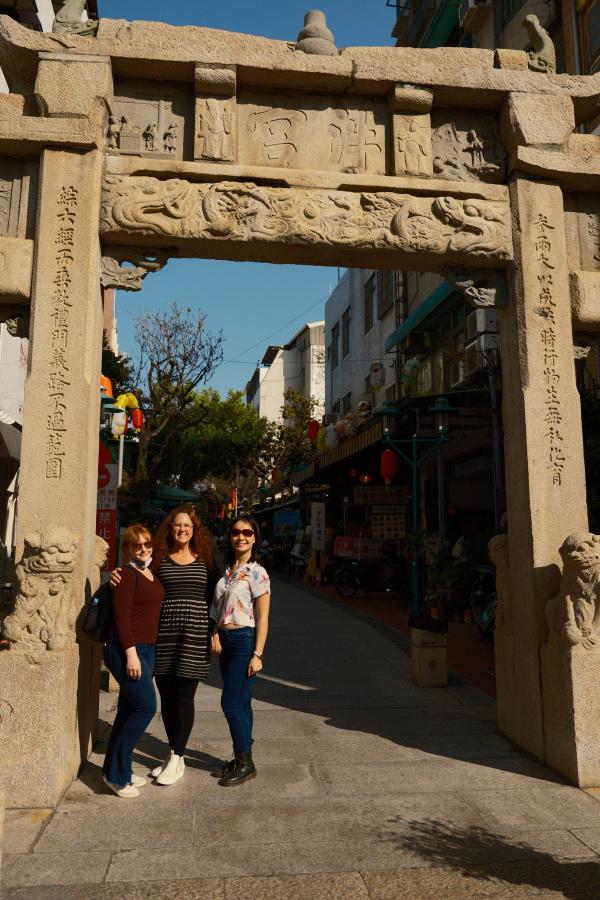Mom, Tammy, Colette in front of an ancient gate in Tainan.