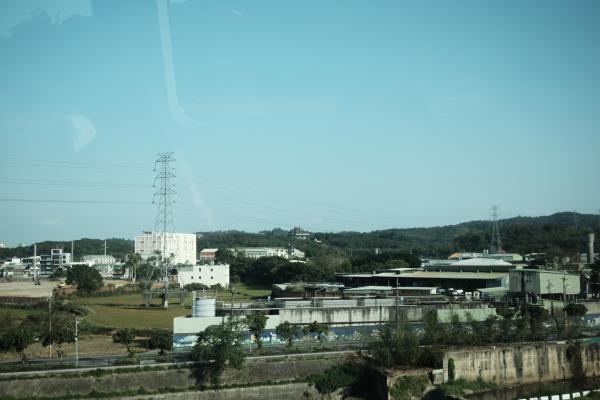 Outside the window of the train, looking onto the rice fields
