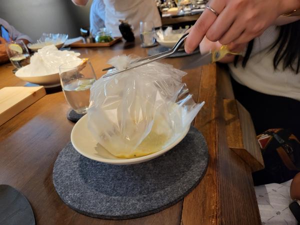 The chicken dish bag being cut