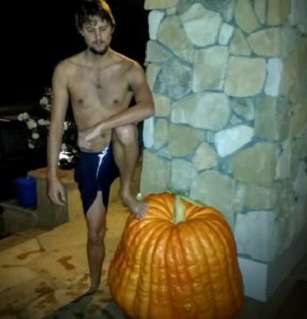 My coworker posing with an enormous pumpkin. 