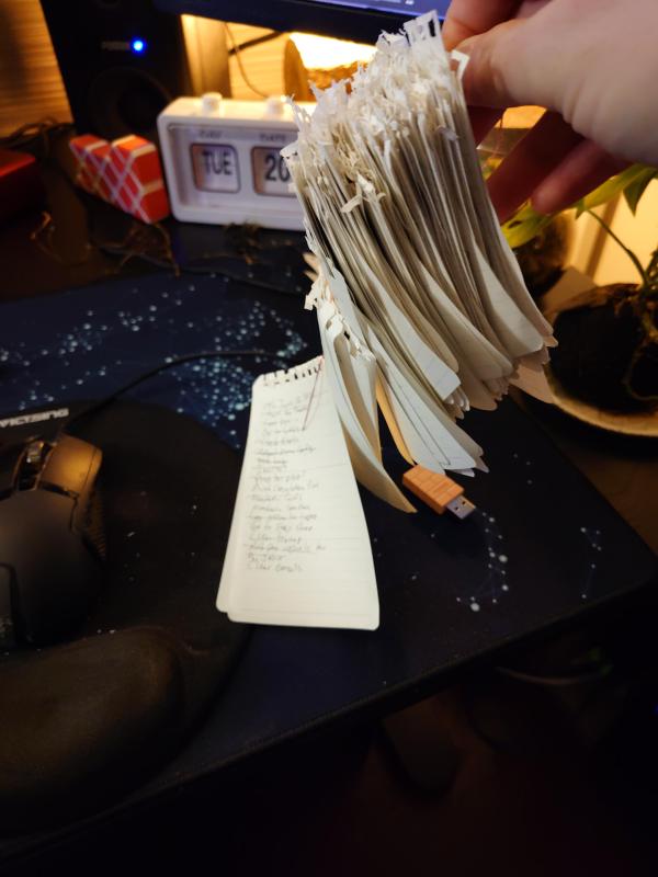 Paper notes strung on a thread