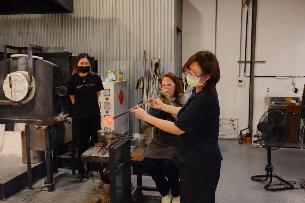 Mom blowing glass