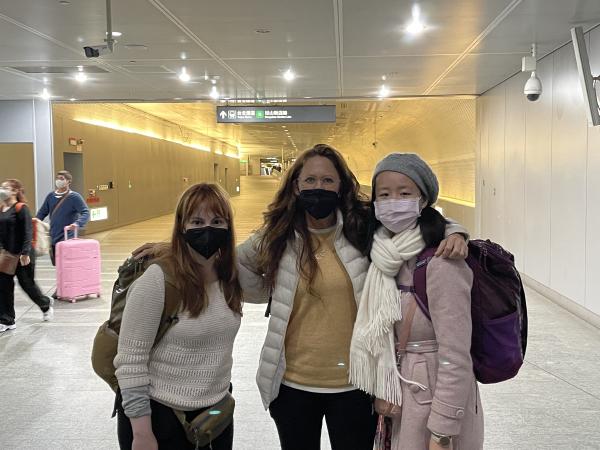 Colette, mom, and Tammy posing in the train station