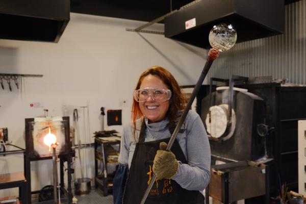 Mom holding the glass blowy tube thing