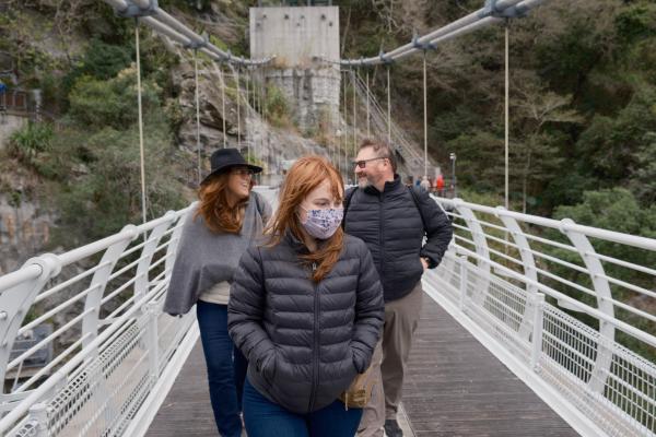 Family on a pedestrian bridge in Taroko