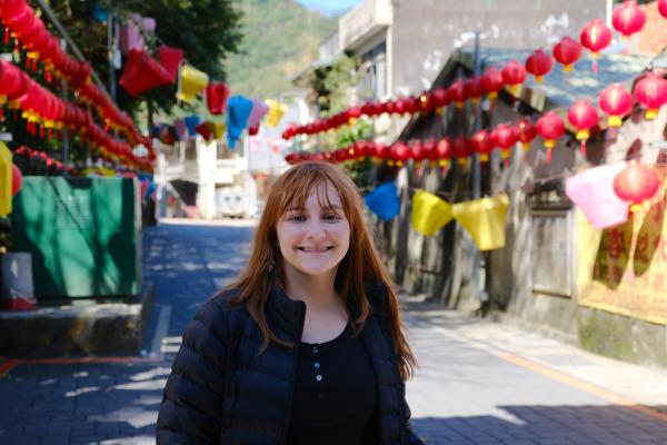 Colette in front of some lanterns