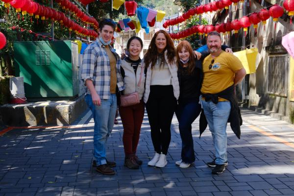 Family in front of some lanterns