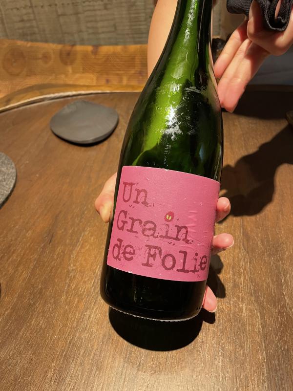 The bottle of the first wine pairing.