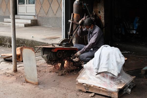 Man cutting metal