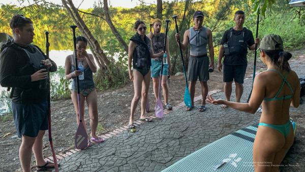 All of us getting some stand up paddleboard coaching