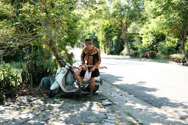 Our tour guide arriving on a scooter