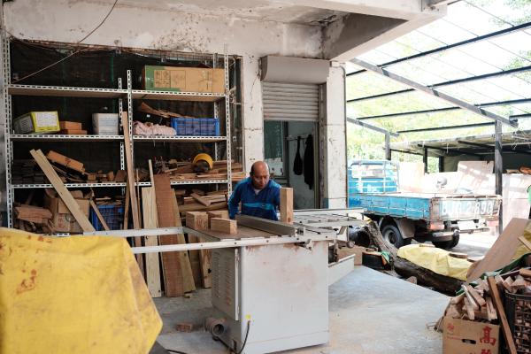 A man working with some wood