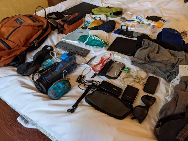 The contents of my bag, spread out on the bed, a second angle.