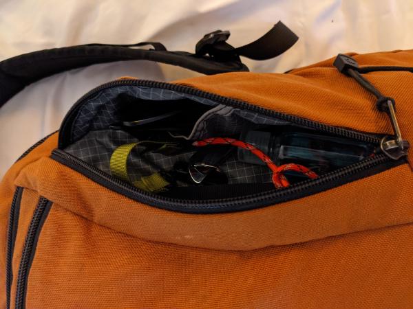My backpack's front right pocket, packed and open.